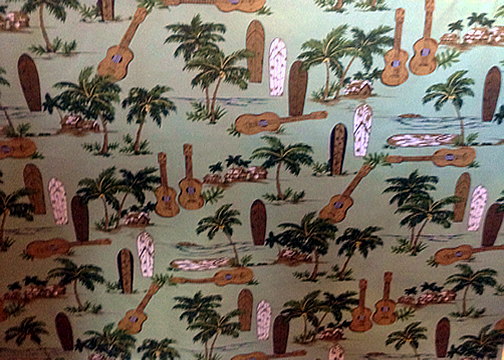 70island life - Surfboards, ukulele, palm trees, and hula huts on a cotton reversible sage apparel fabric.