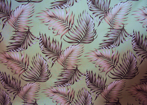 Malihini Tropical Hawaiian Leafy Pattern on a bark crepe textured bark cloth fabric.