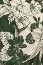 70millia Tropical leafy green and white flowers on cotton poplin apparel fabric. 