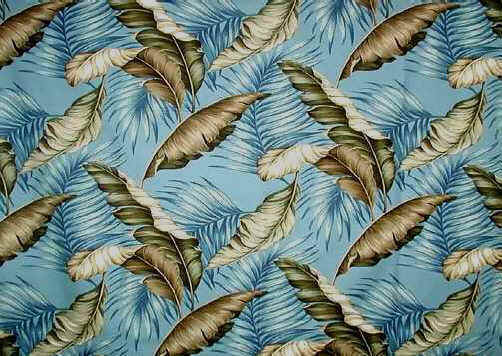 This 100% cotton upholstery tropical Hawaiian Bark cloth fabric is covered with palm and banana leaves in various tones of greens. This large print gives the illusion of falling leaves. It looks like it came right out of the art deco er during the 1950's. It is 55" wide with a repeat pattern of 24" This one has a blue background and it also is available in natural and black.