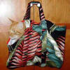 Pet Carrier Size: Fits a medium sized buddy, about 14" tall x 20" wide (when fully stretched out)